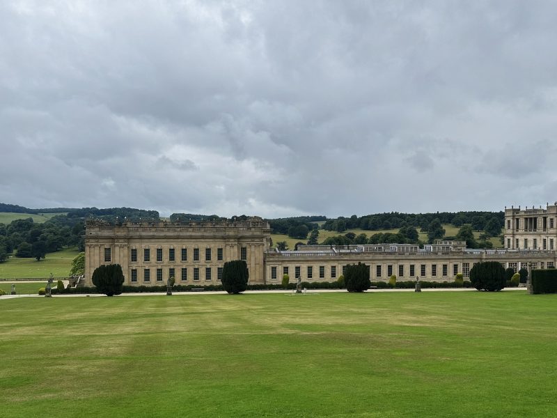 A view across the gardens towards the back of Chatsworth House – a stunning stone stately home.