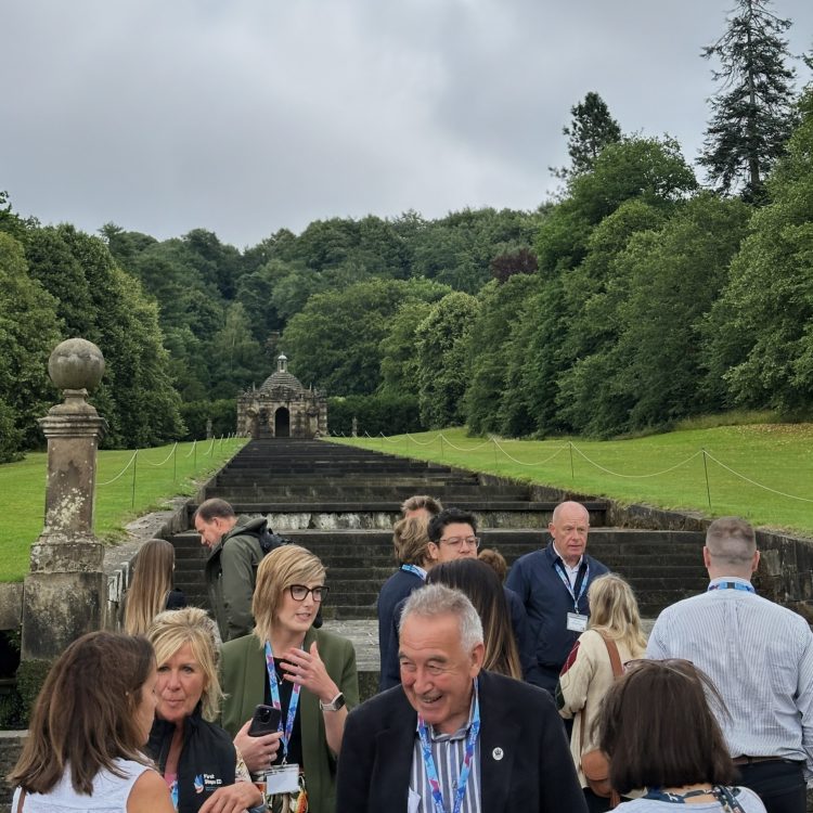 The Marketing Derby event attendees mingling in front of the historic Chatsworth House cascade in the gardens of the estate.